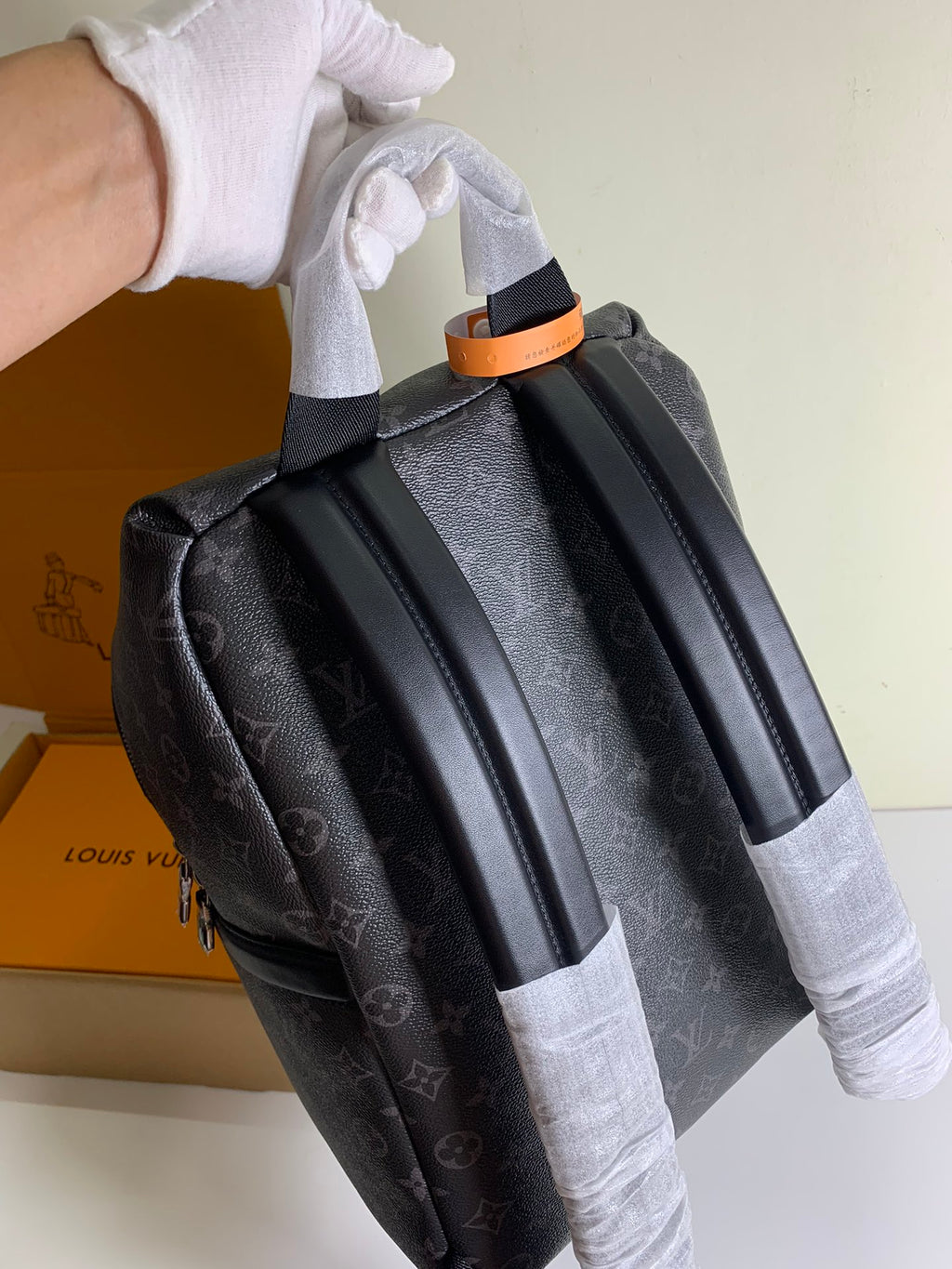 Louis Vuitton monogram backpack, side view with handles and top carry strap