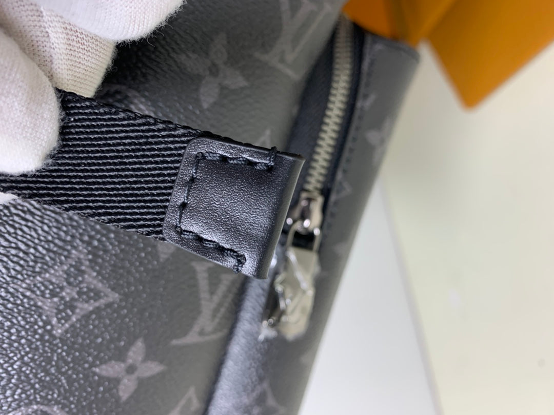 Louis Vuitton monogram bag strap buckle detail with metal hardware