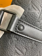 Louis Vuitton bag strap buckle with engraved logo and stitched leather edge