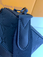 Louis Vuitton blue leather bag with top flap, stitched handle loop, and strap