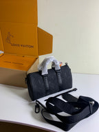 Louis Vuitton dark monogram bag with shoulder strap and hanging tag