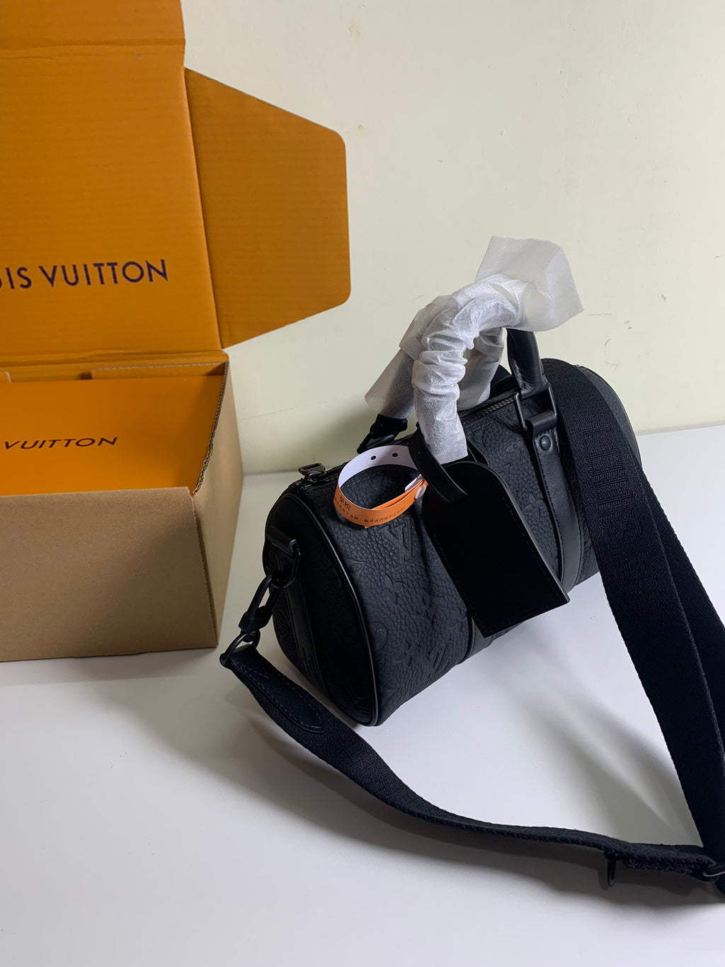 Louis Vuitton dark monogram bag with top handles and detachable shoulder strap
