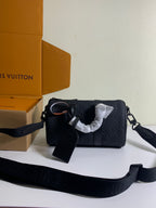 Louis Vuitton dark monogram bag with crossbody strap and attached hang tag