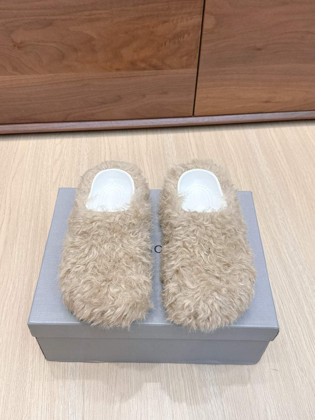 Beige faux-fur slide sandals with white open-toe interior