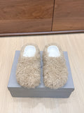 Beige faux-fur slide sandals with white open-toe interior