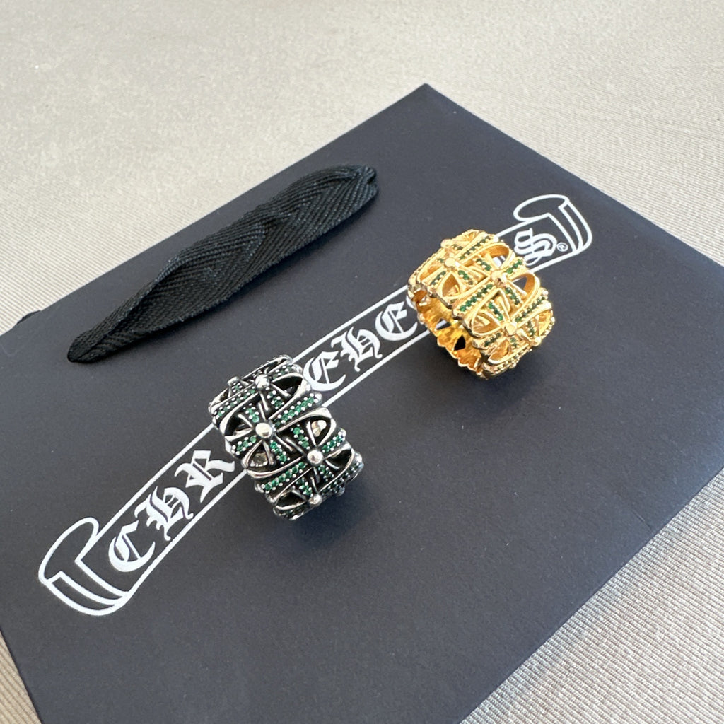 Chrome accessories rings on black polishing cloth card, gold and black crown designs
