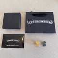 Chrome accessories set with two gift boxes, silver polishing cloth, and two rings