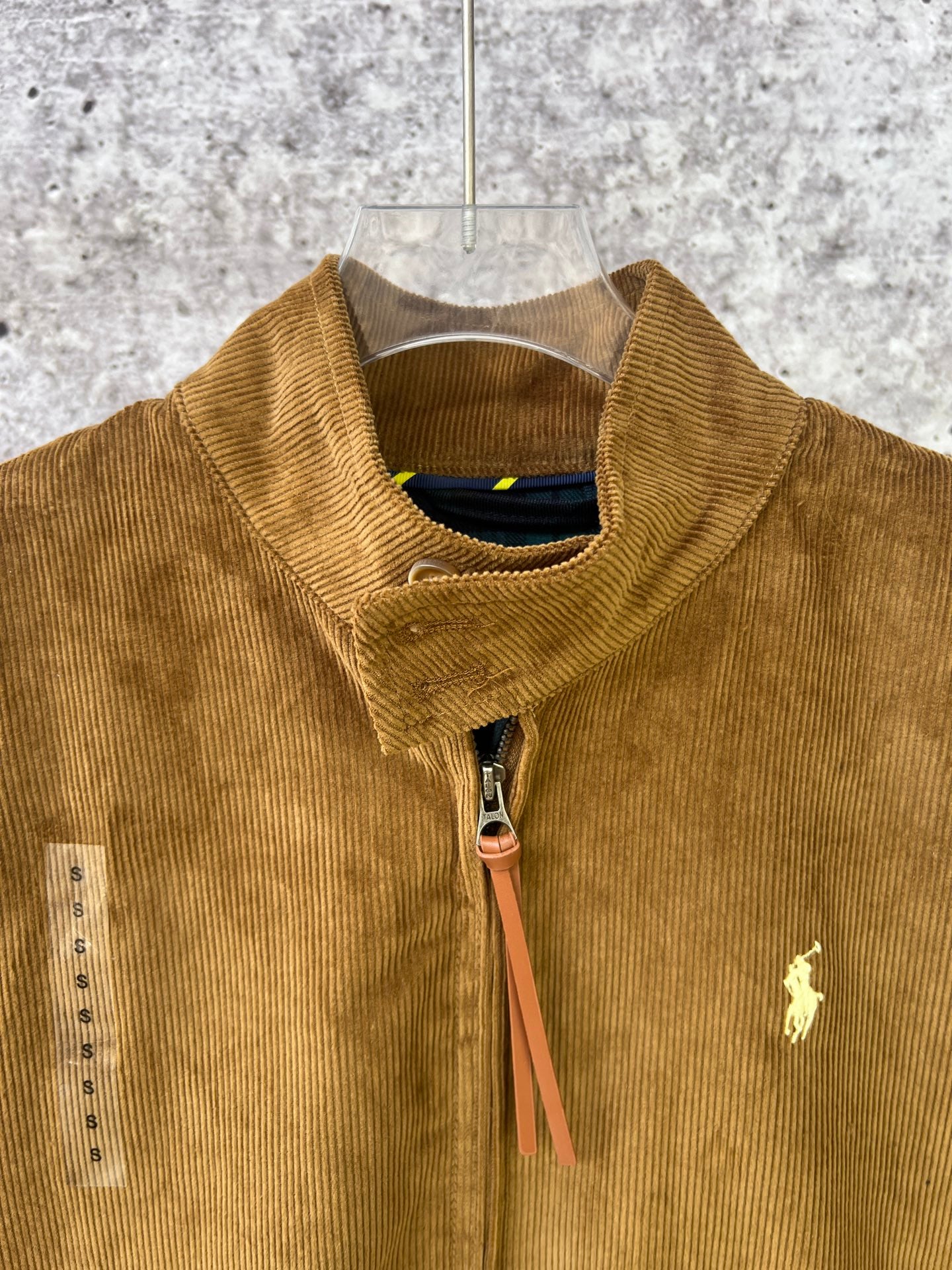 Ralph Lauren corduroy jacket close-up, tan stand collar and zip with polo logo