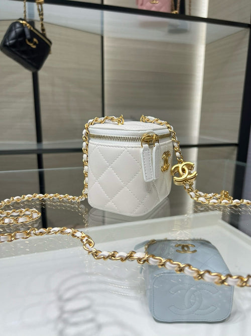 White quilted mini bag with gold CC logo, chain strap, top zip closure