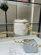 White quilted mini bag with gold chain, front CC logo, and zip closure.