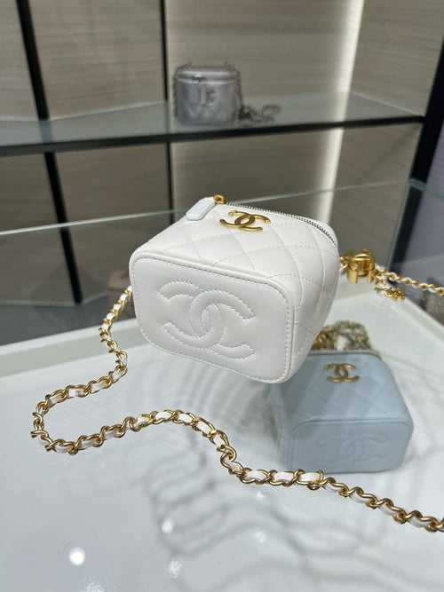 White quilted mini bag with gold-tone CC logo patch and gold chain strap