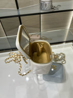 White quilted mini bag with open top, gold interior lining, gold chain strap