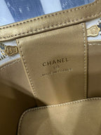 Gold leather bag label with CHANEL and MADE IN FRANCE text, stitched border