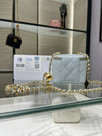 Chanel light blue quilted mini bag with gold chain shoulder strap and zipper