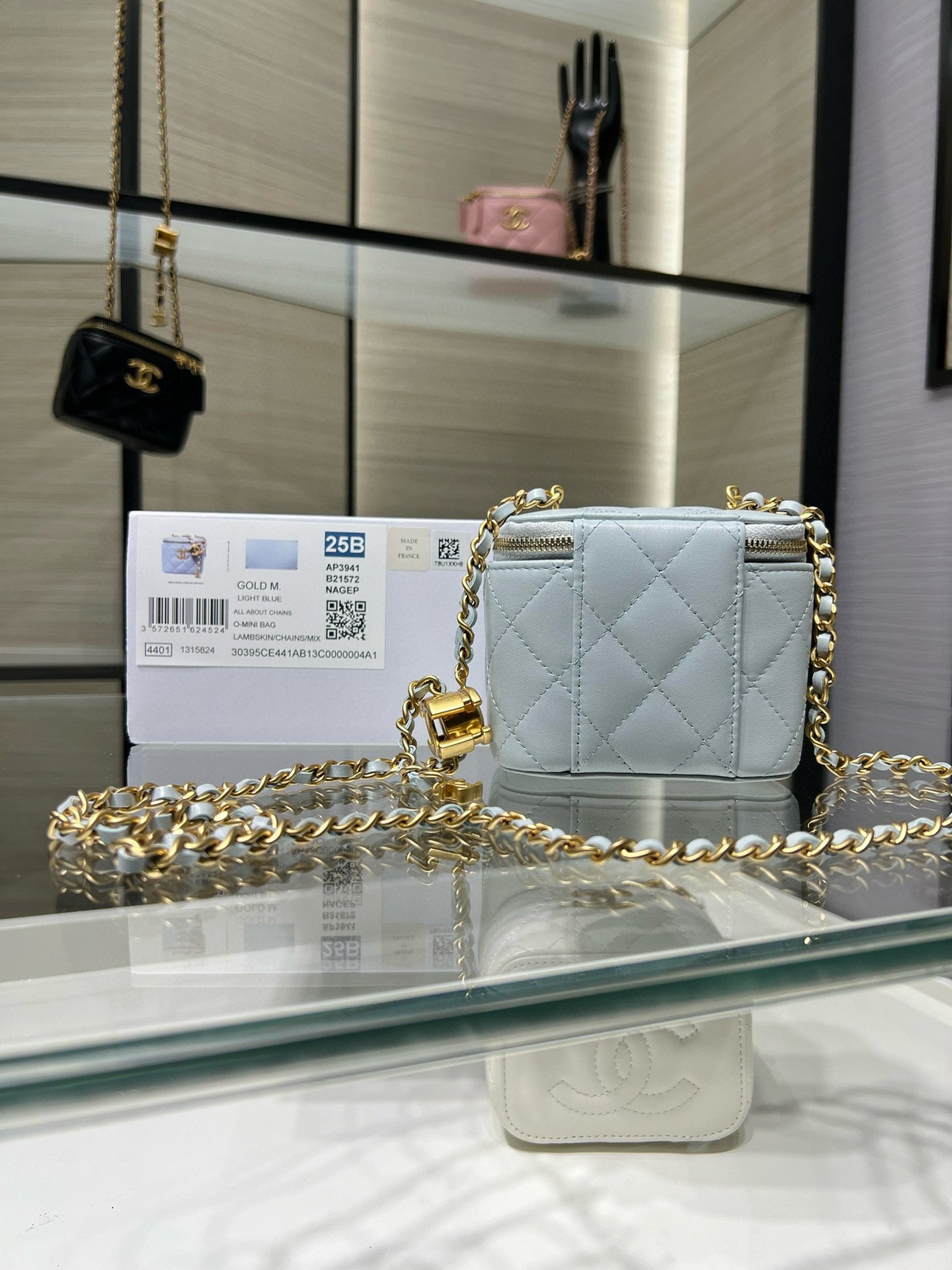 Chanel light blue quilted mini bag with gold chain shoulder strap and zipper