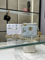 Chanel light blue quilted mini crossbody bag with gold chain strap and zipper top
