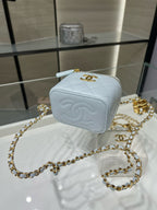 Light blue Chanel crossbody mini bag with quilted texture, gold chain, zipper
