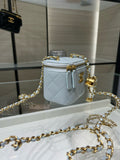 Light blue quilted Chanel mini bag with gold chain strap and top zipper