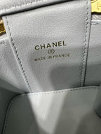 Light blue Chanel bag label reading CHANEL and MADE IN FRANCE