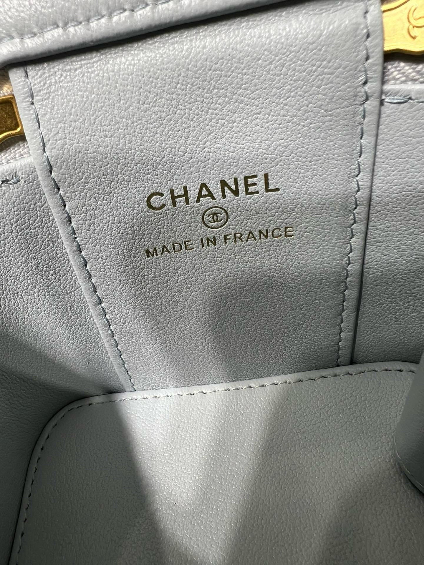 Light blue Chanel bag label reading CHANEL and MADE IN FRANCE