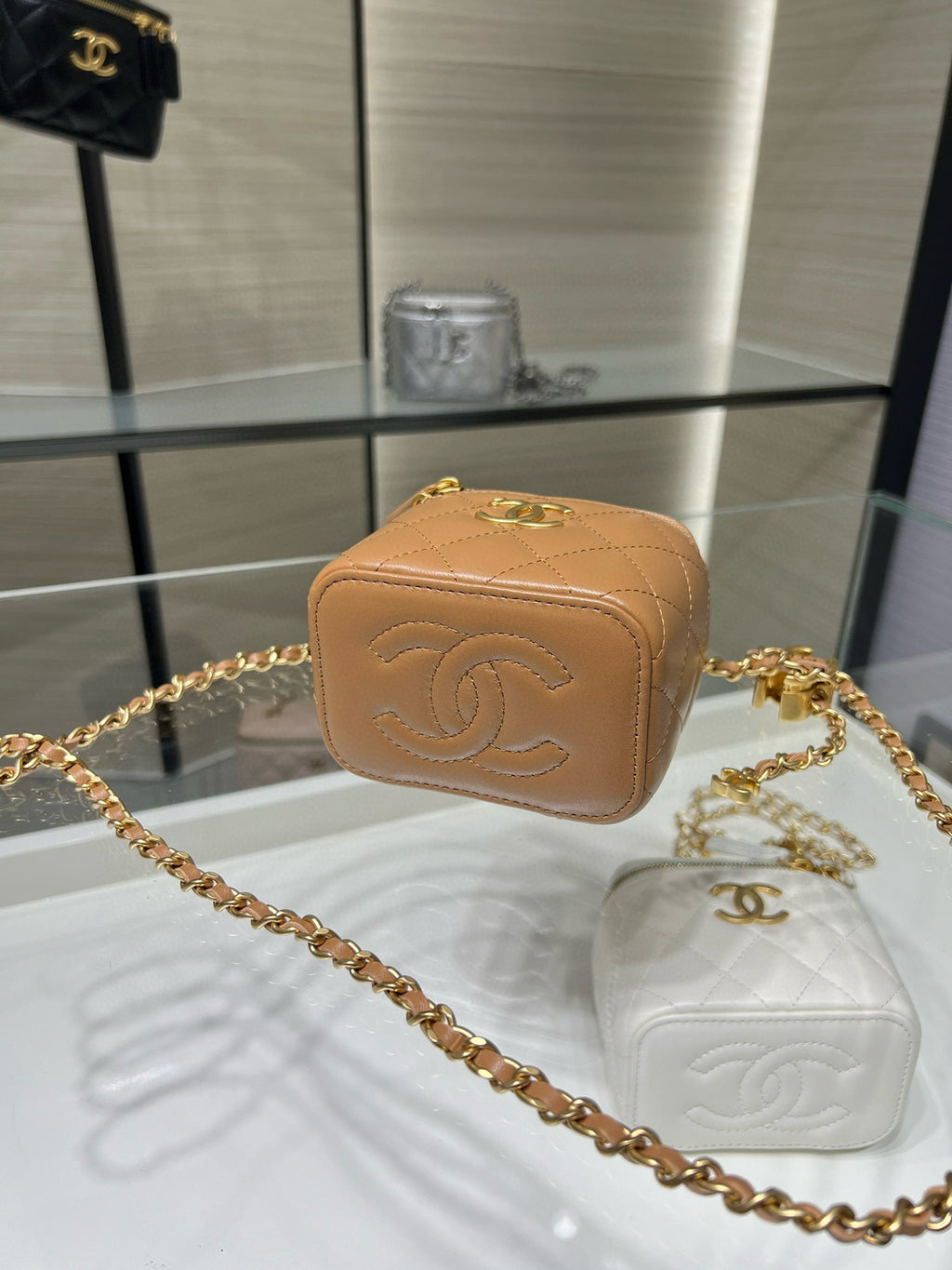 Chanel mini quilted leather bag with embossed CC on front and gold-tone chain