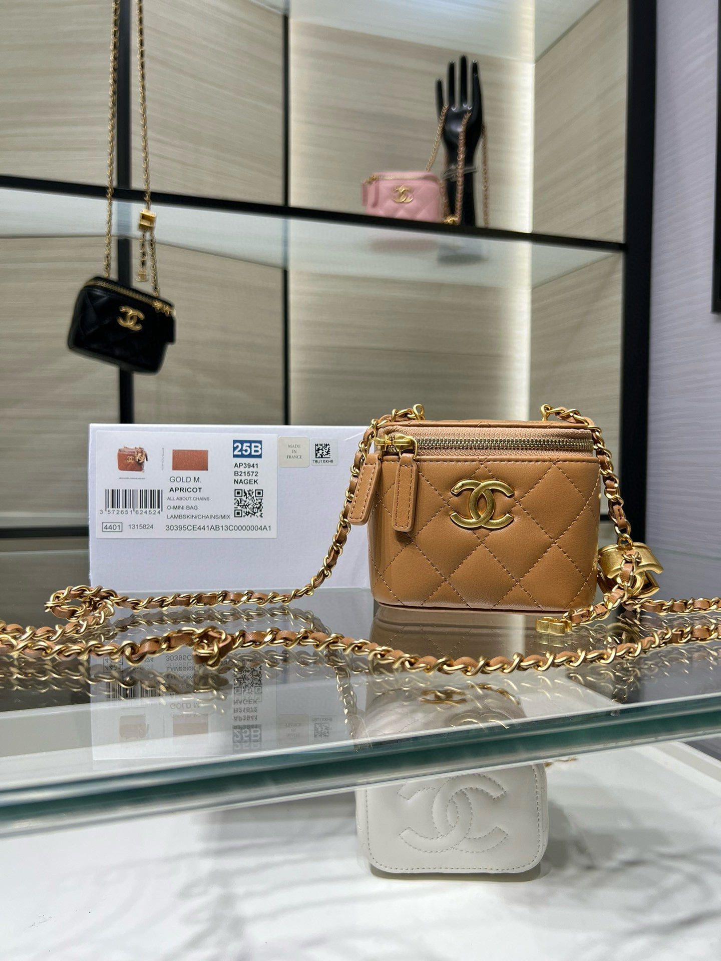 Chanel mini quilted leather bag with gold-tone chain and gold CC hardware