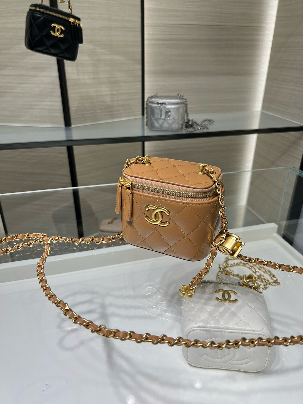 Mini quilted crossbody bag, beige with zip top, gold chain strap and CC logo