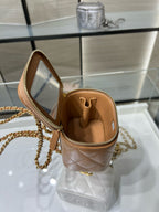 Mini quilted crossbody bag, beige exterior with open top and gold clasp