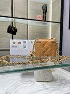 Chanel mini quilted leather crossbody bag with gold-tone chain and CC charm
