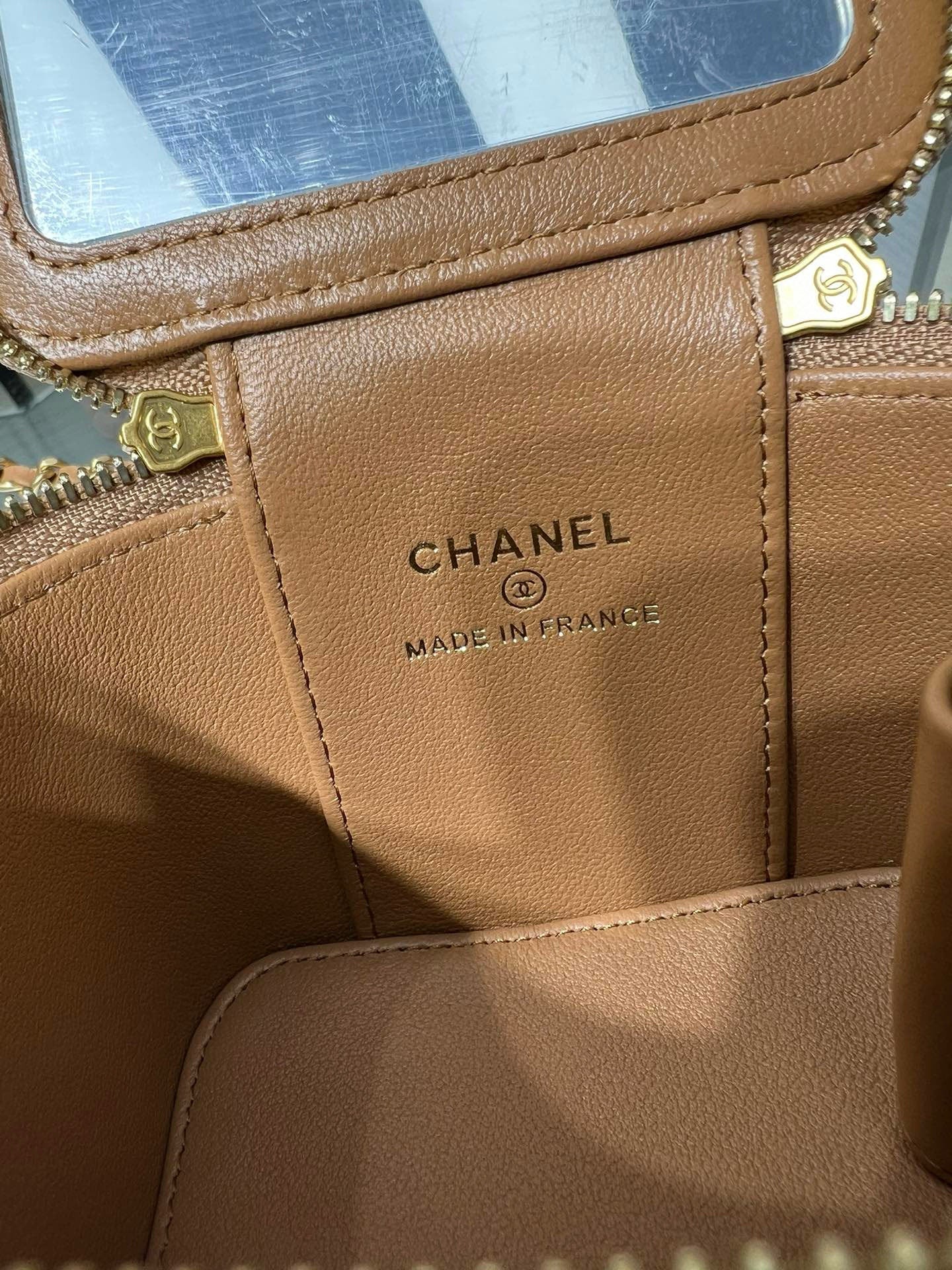 Chanel leather bag interior label: CHANEL and MADE IN FRANCE on tan lining