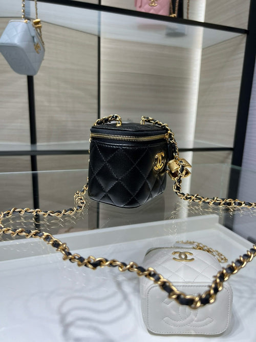 Chanel mini crossbody bag, black quilted leather with gold chain and zip top