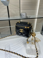 Chanel mini crossbody bag, black quilted leather with gold logo and zip closure
