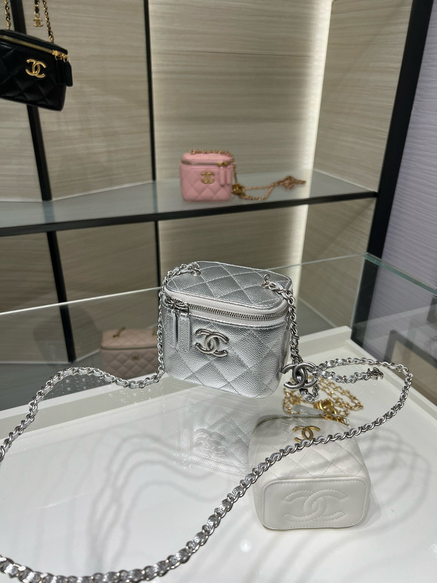 Silver quilted crossbody bag with chain strap and small flap, CC logo detail