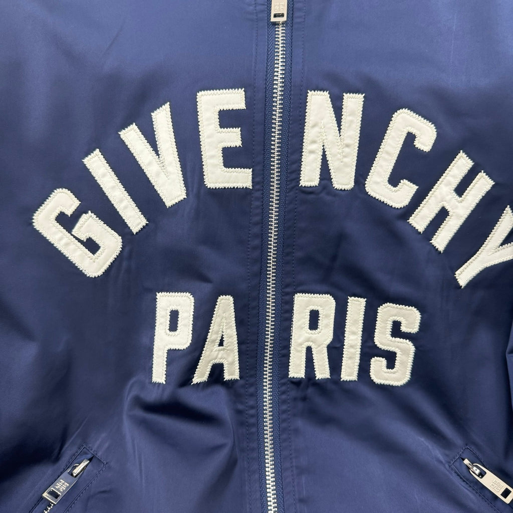 Dark blue bomber jacket zip front with "GIVE NCHY" and "PARIS" lettering
