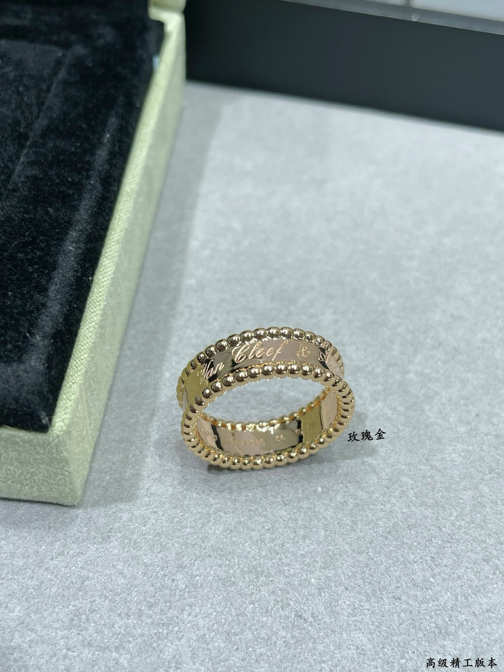 Van Cleef & Arpels gold band ring with scalloped edge and small stones, side view