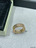 Van Cleef & Arpels gold band ring with scalloped edge and small stones, side view