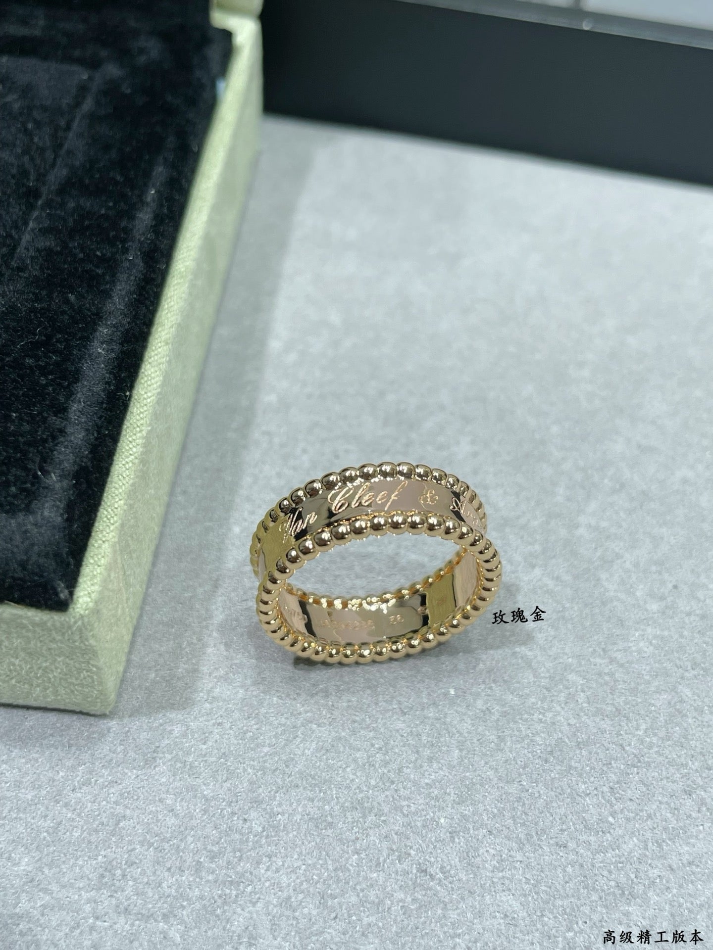 Van Cleef & Arpels gold band ring with scalloped edge and small stones, side view