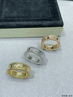 Van Cleef & Arpels band rings set: three jeweled stack rings in gold and silver