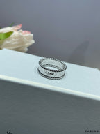 Van Cleef & Arpels silver band rings, two stacked bands with small bead-like stones
