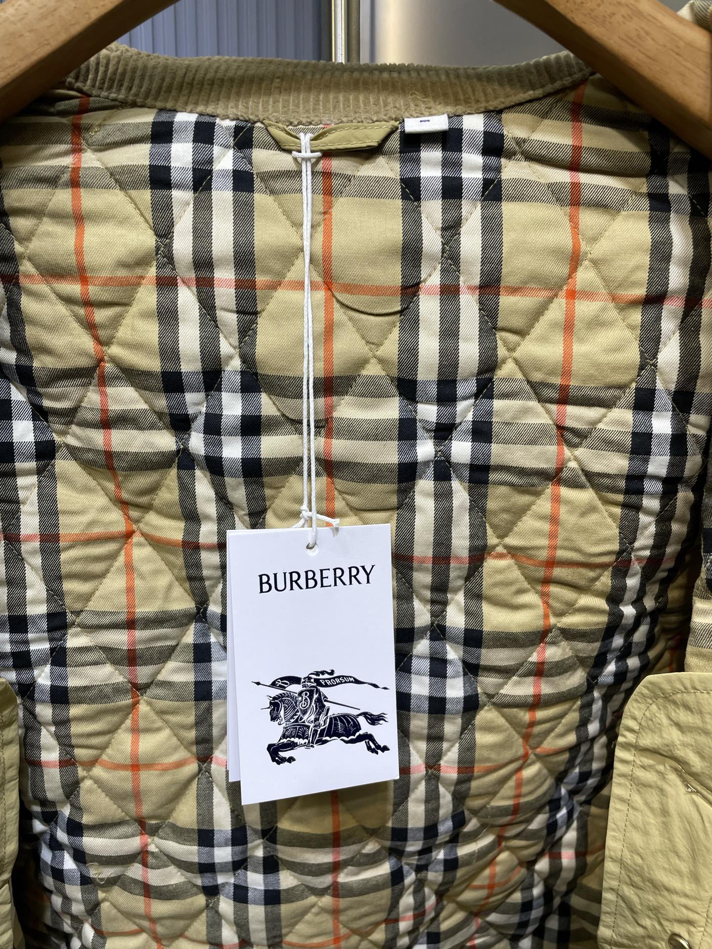Burberry plaid lining with inner tag and quilted yellow fabric backing.