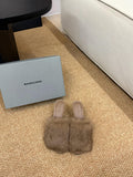 Taupe faux-fur slide sandals with open toe and slim, clear toe strap