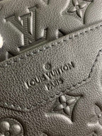 Louis Vuitton embossed monogram leather patch, dark grain and stitching detail