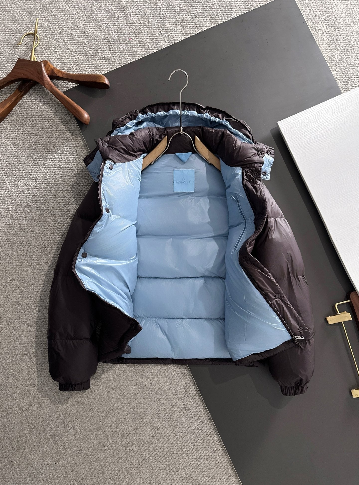 Moncler hooded puffer jacket, dark shell, light blue interior lining