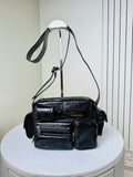 Balenciaga black leather crossbody bag with top handle and front zip pockets