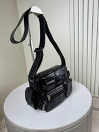 Balenciaga black leather crossbody bag with wide strap and front flap pockets