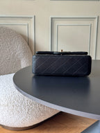 Chanel quilted leather shoulder bag back view with gold logo hardware