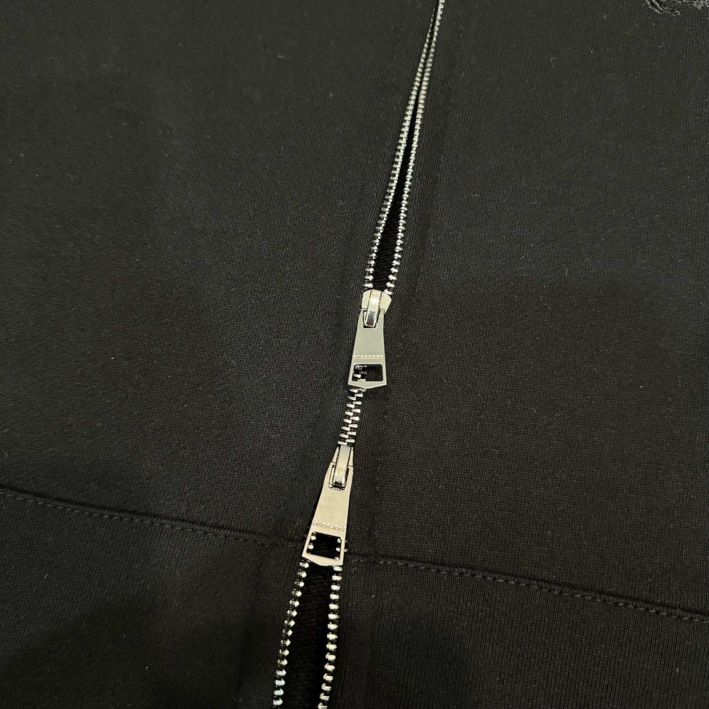 Black jacket zipper with metal pull