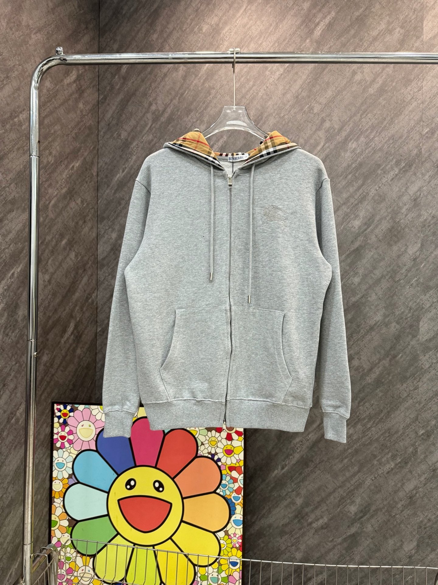 Light gray zip-up hoodie with drawstring hood and small Burberry horse logo