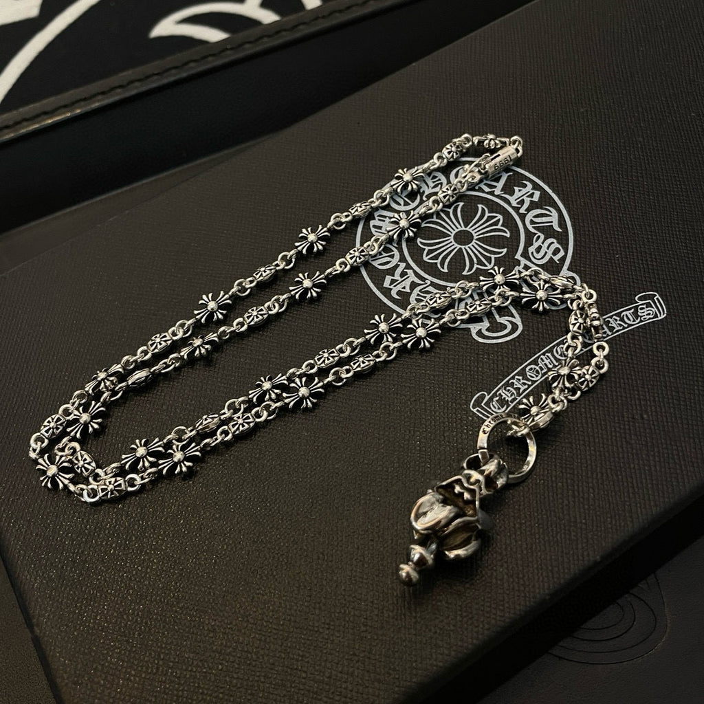 Chrome accessories silver-tone bracelet with floral links and dangling charm