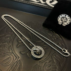 Chrome Accessories double-strand necklace with round pendant on embossed tray.